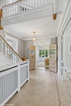 a view of staircase with white walls and windows