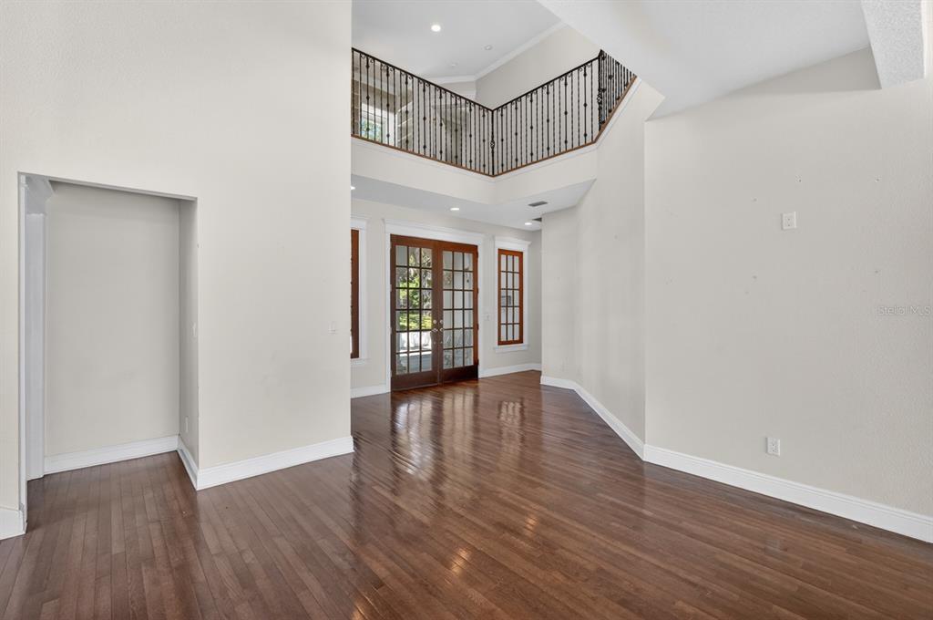 70 Riverside Drive Ormond Beach, FL 32176 - Photo 17 of 68 a view of an entryway with wooden floor