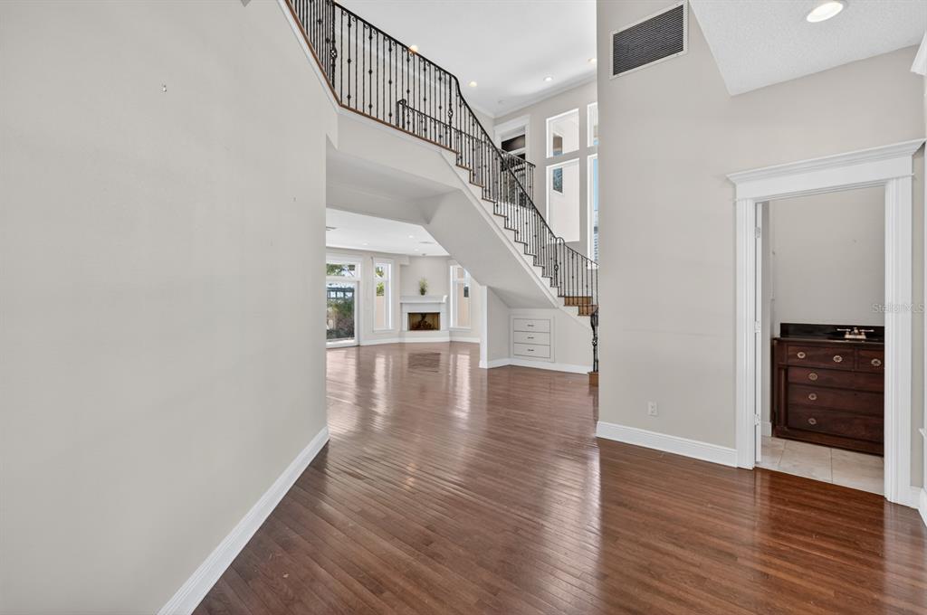 70 Riverside Drive Ormond Beach, FL 32176 - Photo 18 of 68 a view of entryway and hall with wooden floor