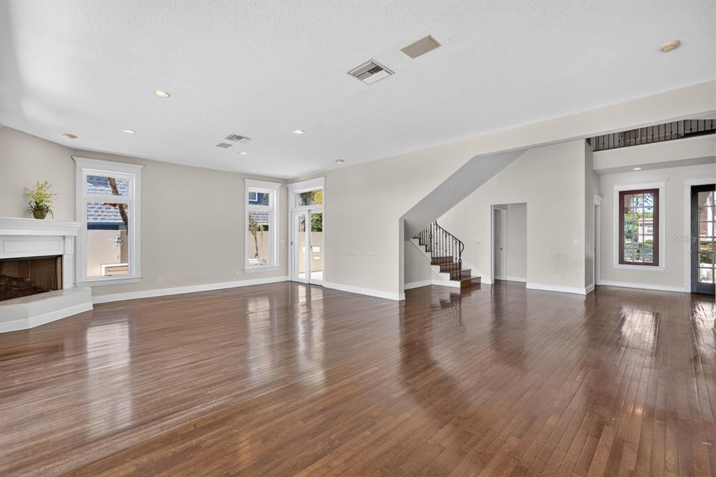 70 Riverside Drive Ormond Beach, FL 32176 - Photo 20 of 68 a view of empty room with wooden floor and fireplace