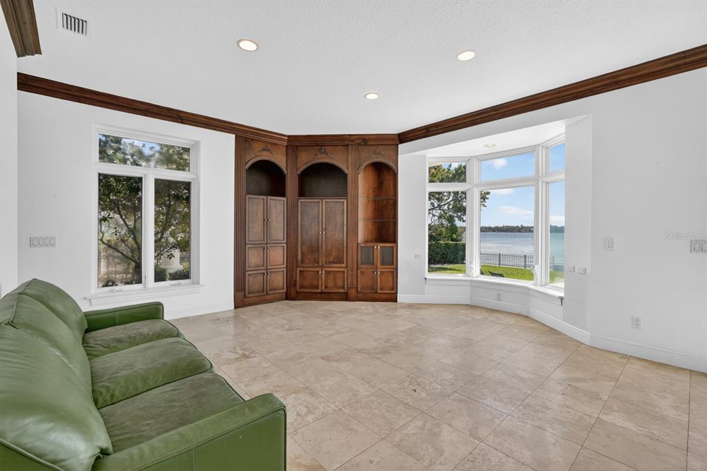 70 Riverside Drive Ormond Beach, FL 32176 - Photo 35 of 68 a living room with furniture and a large window