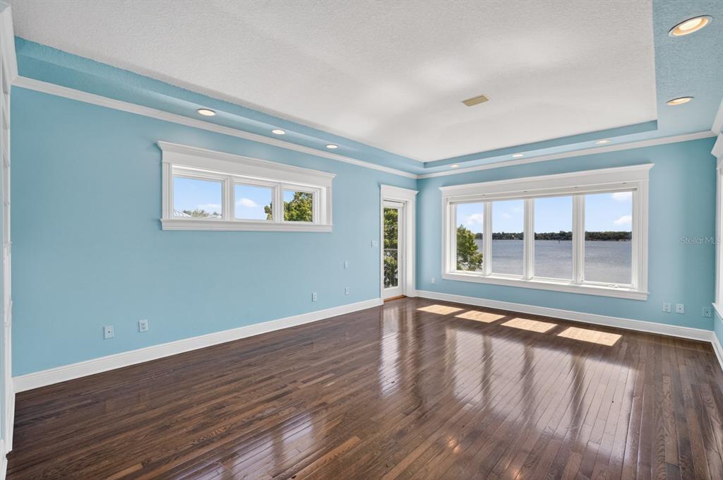 70 Riverside Drive Ormond Beach, FL 32176 - Photo 39 of 68 a view of an empty room with wooden floor and a window