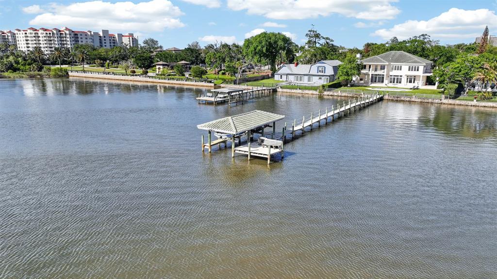 70 Riverside Drive Ormond Beach, FL 32176 - Photo 5 of 68 a view of swimming pool with outdoor seating and lake view