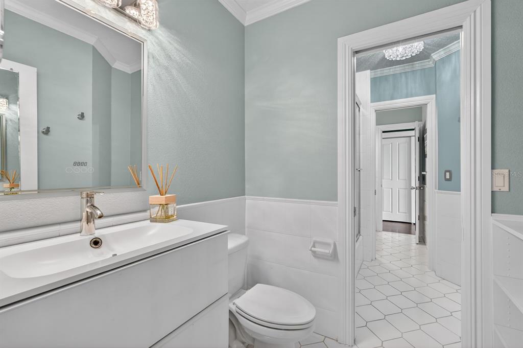 70 Riverside Drive Ormond Beach, FL 32176 - Photo 52 of 68 a bathroom with a sink a toilet and shower