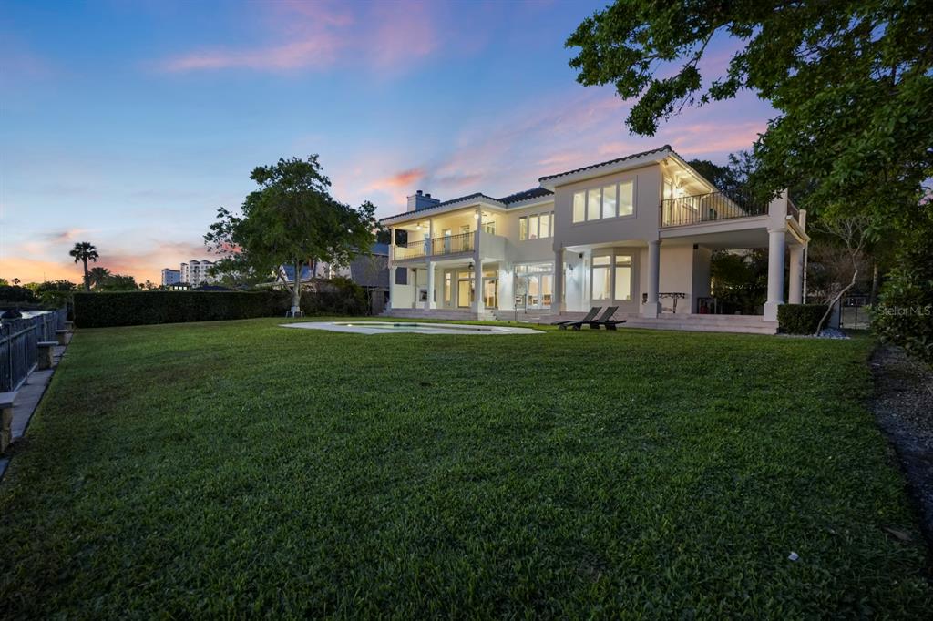 70 Riverside Drive Ormond Beach, FL 32176 - Photo 68 of 68 a front view of a house with a garden