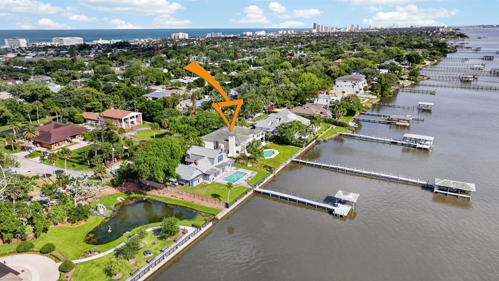 70 Riverside Drive Ormond Beach, FL 32176 - Photo 10 of 68 an aerial view of a houses with a yard