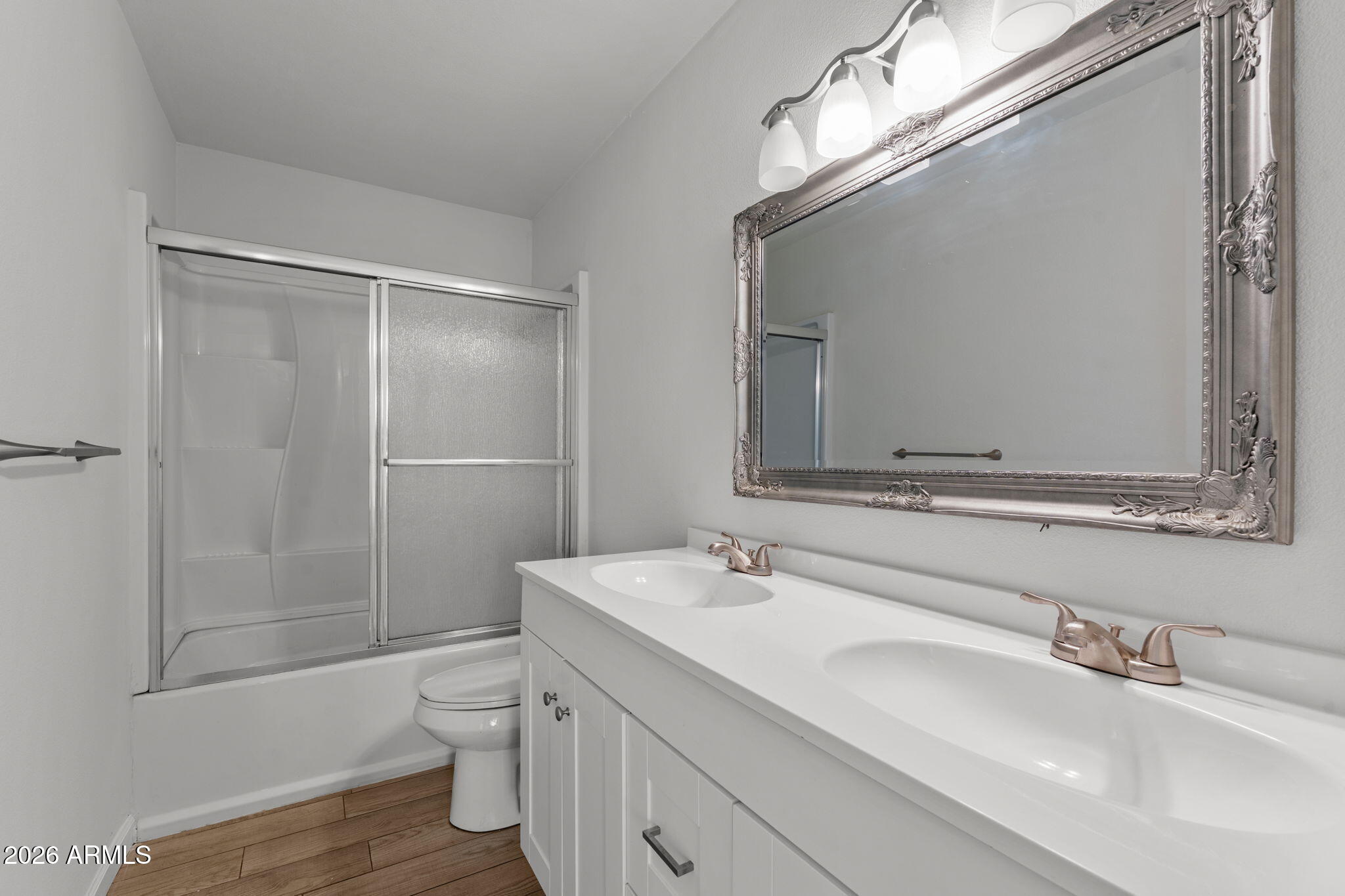 9257 West Gary Road Peoria, AZ 85345 - Photo 12 of 28 a bathroom with a sink a toilet and shower