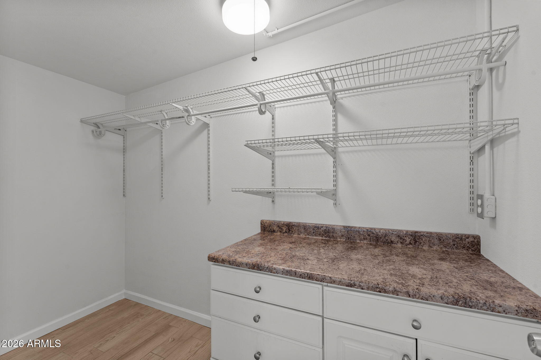 9257 West Gary Road Peoria, AZ 85345 - Photo 16 of 28 a bathroom with a granite countertop sink and vanity