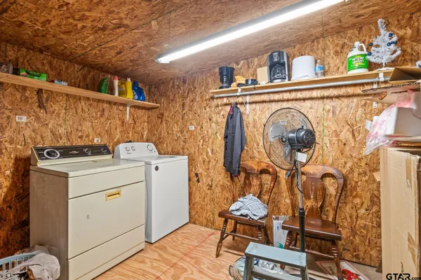 a bed room with a bed and a chair