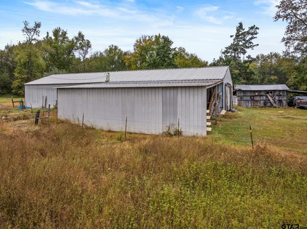 a view of a yard with trees