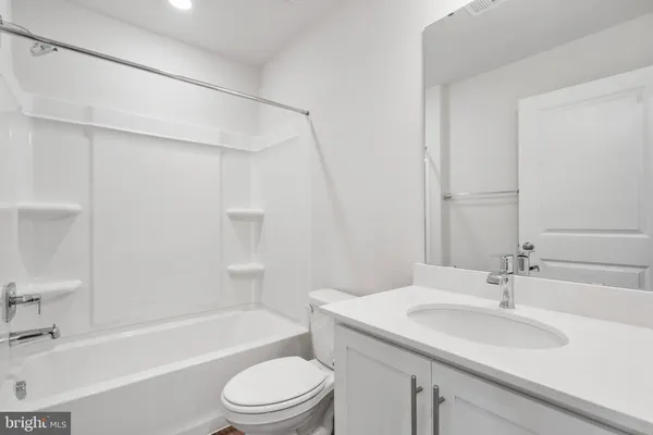 a bathroom with a sink a toilet and a bathtub