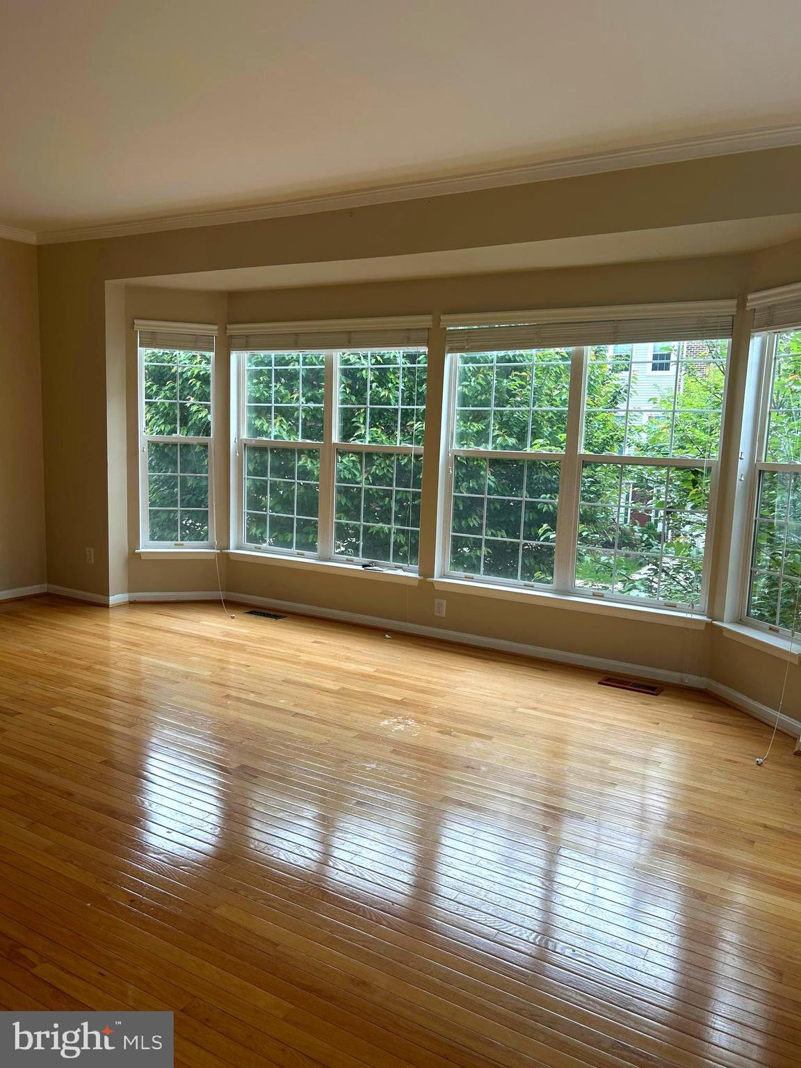 4658 Buckhorn Ridge Fairfax, VA 22030 - Photo 9 of 35 a view of empty room with wooden floor and fan