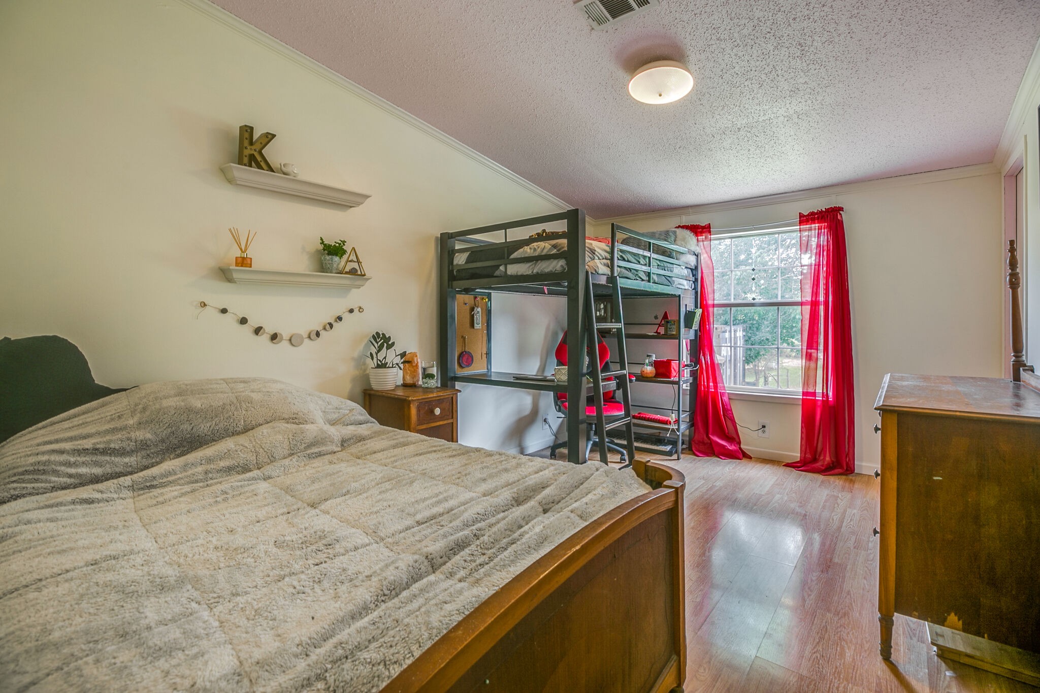 612 Norene Road Lebanon, TN 37090 - Photo 16 of 31 a bedroom with a bed and a wooden floor