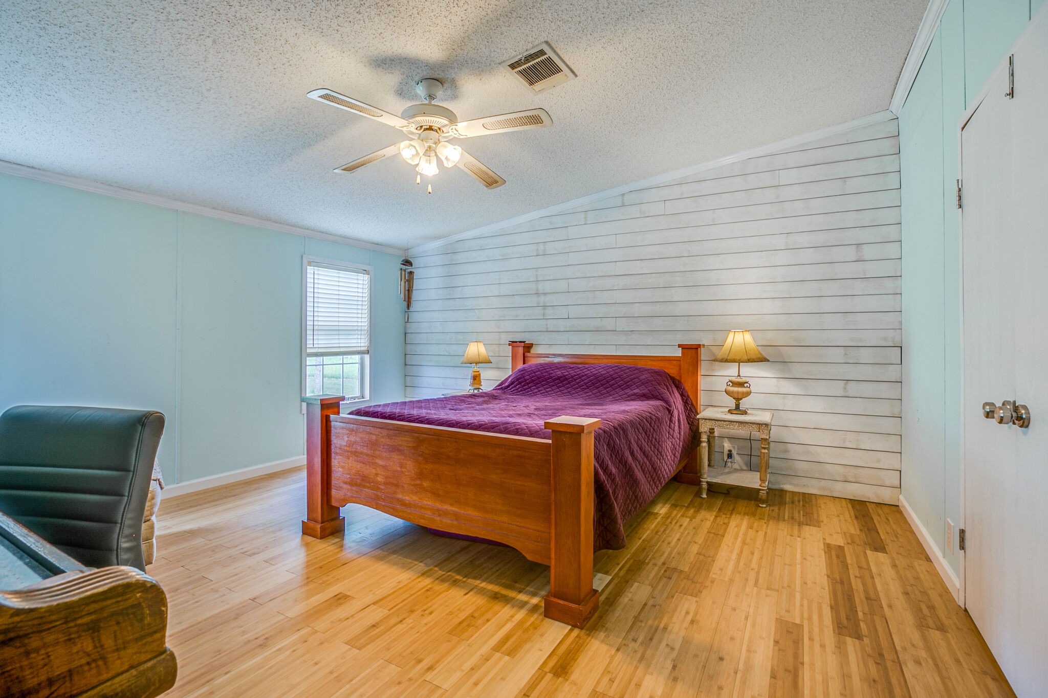 612 Norene Road Lebanon, TN 37090 - Photo 17 of 31 a spacious bedroom with a bed and wooden floor