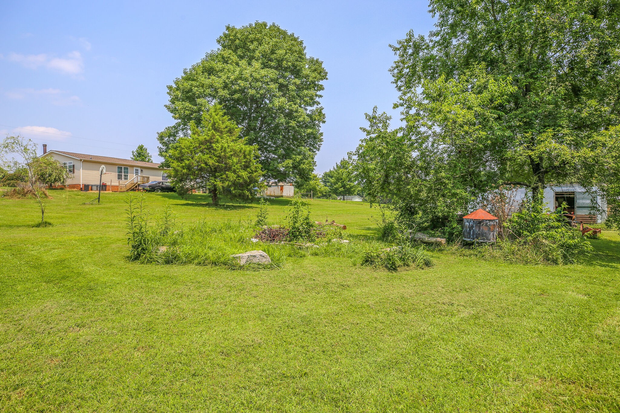 612 Norene Road Lebanon, TN 37090 - Photo 25 of 31 a backyard of a house with a yard and outdoor seating