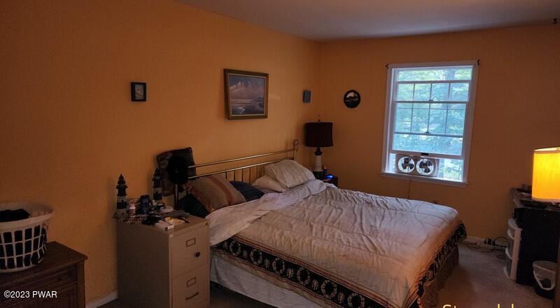 249 Pin Oak Road Stroudsburg, PA 18360 - Photo 26 of 34 a bedroom with a bed and a window