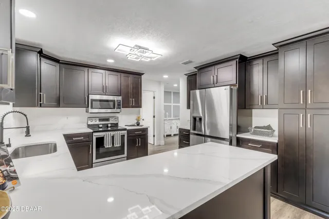 a kitchen with a sink and a window
