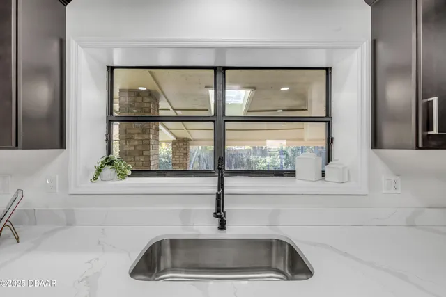 a kitchen with stainless steel appliances a refrigerator stove and microwave