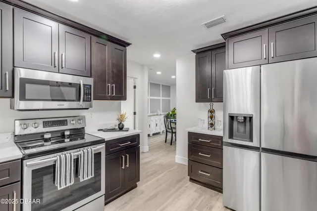 a kitchen with a refrigerator and countertop