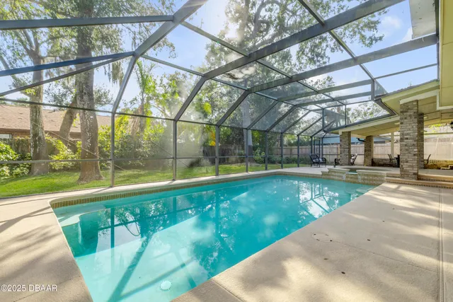 a view of a swimming pool with a porch