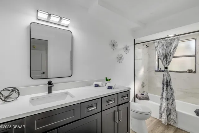 a bathroom with a shower and a toilet