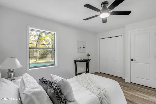 a bedroom with a bed and window