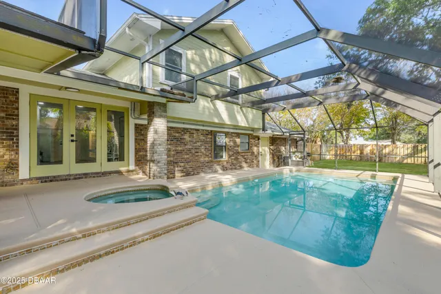 a view of a swimming pool with a patio