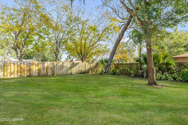 a view of a house with a backyard porch and sitting area
