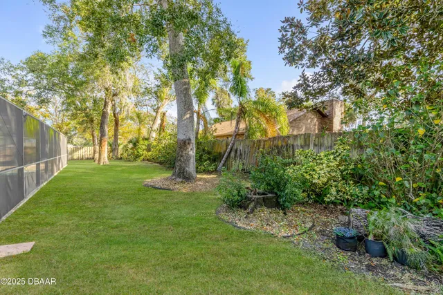 a view of lake with houses in the background