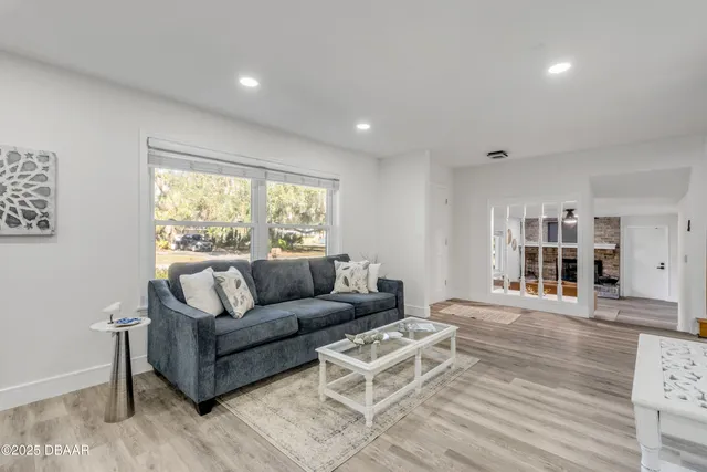 a view of a dining room with furniture and window