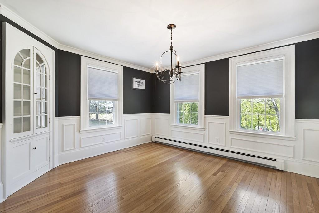 16 Bashaw Road Sutton, MA 01590 - Photo 13 of 37 a view of empty room with wooden floor and windows