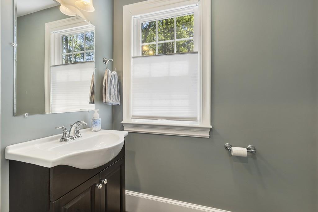 16 Bashaw Road Sutton, MA 01590 - Photo 16 of 37 a bathroom with a sink a vanity and a window