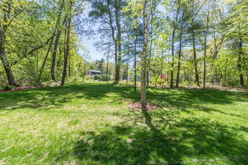 16 Bashaw Road Sutton, MA 01590 - Photo 36 of 37 a backyard of a house with lots of green space