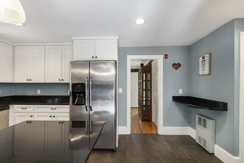 16 Bashaw Road Sutton, MA 01590 - Photo 8 of 37 a kitchen with stainless steel appliances a refrigerator and a stove