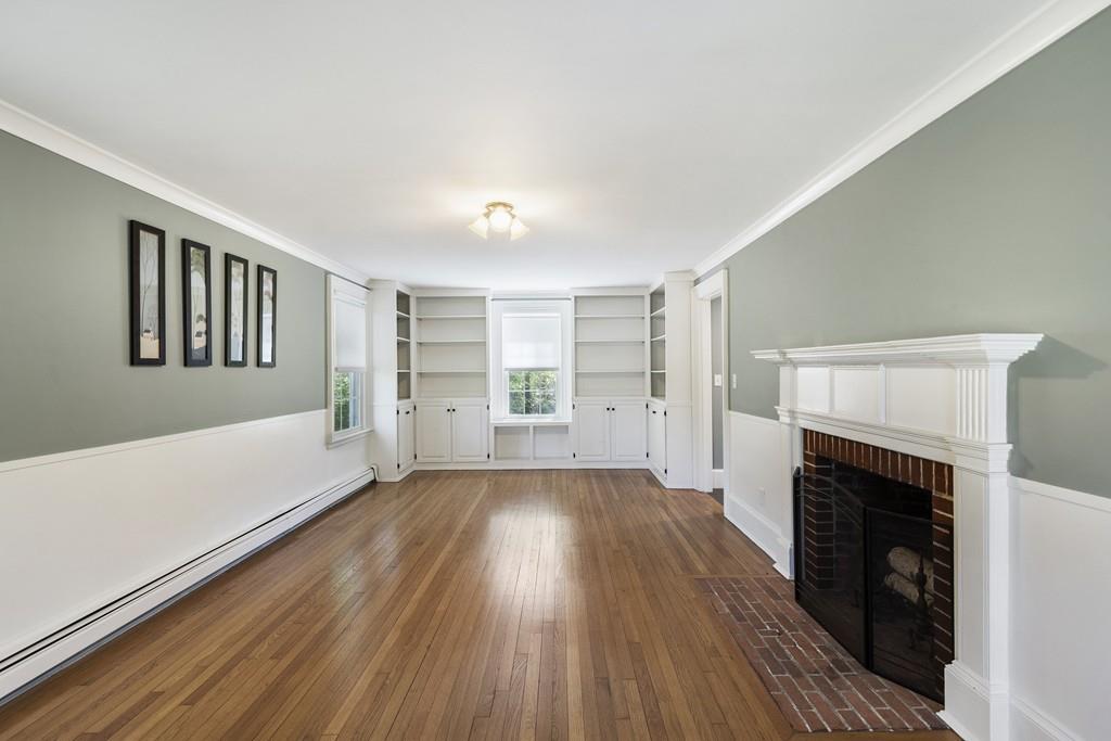 16 Bashaw Road Sutton, MA 01590 - Photo 10 of 37 wooden floor in an empty room with a fireplace