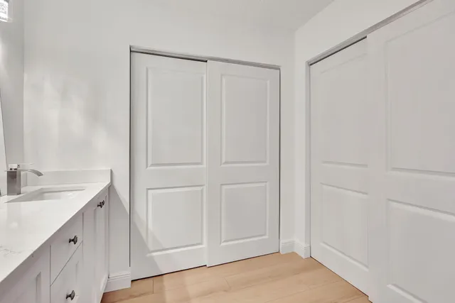 a bathroom with a sink and a mirror