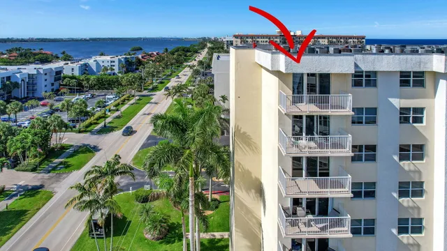 a view of a swimming pool with a lounge chair
