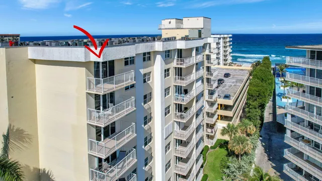 a view of a swimming pool with a lounge chair