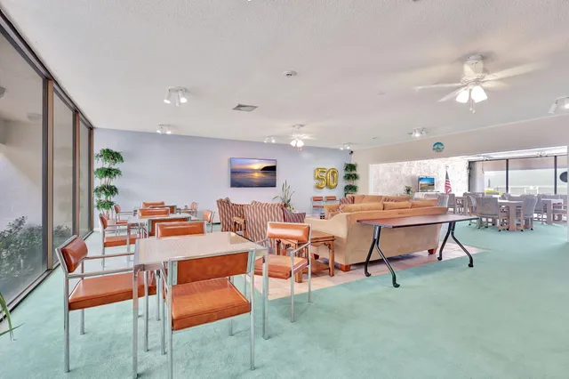 a view of swimming pool with an outdoor space and seating