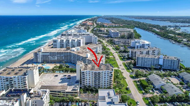 an aerial view of a city and lake view