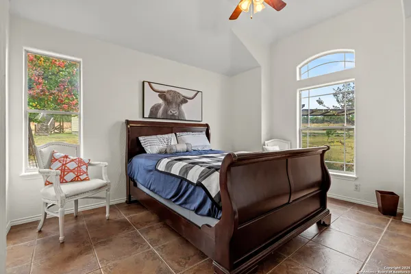 a bedroom with a bed and window