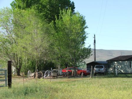 15531 Fisk Road Yakima, WA 98908 - Photo 2 of 2 a view of a house with a yard and sitting area