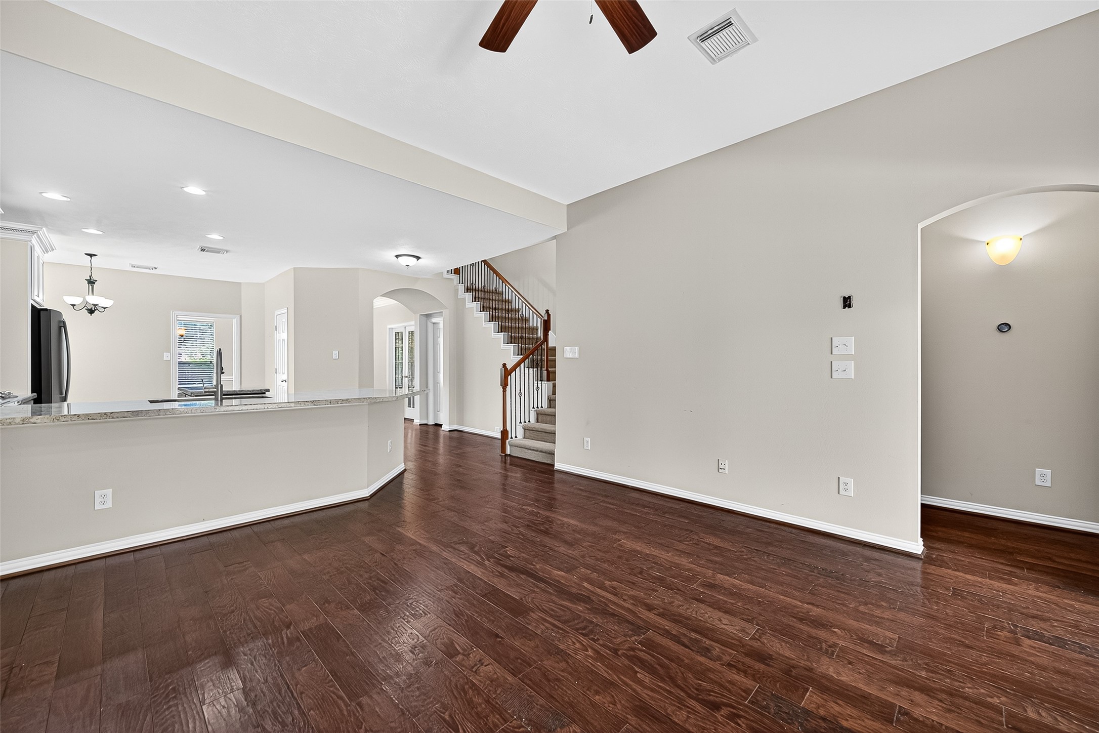 30 Whetstone Ridge Way The Woodlands, TX 77382 - Photo 14 of 39 a view of an empty room with wooden floor and a window