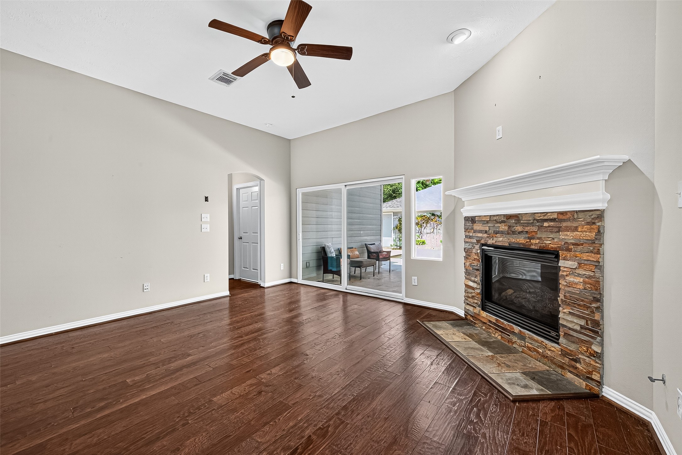 30 Whetstone Ridge Way The Woodlands, TX 77382 - Photo 15 of 39 an empty room with floor fireplace and windows
