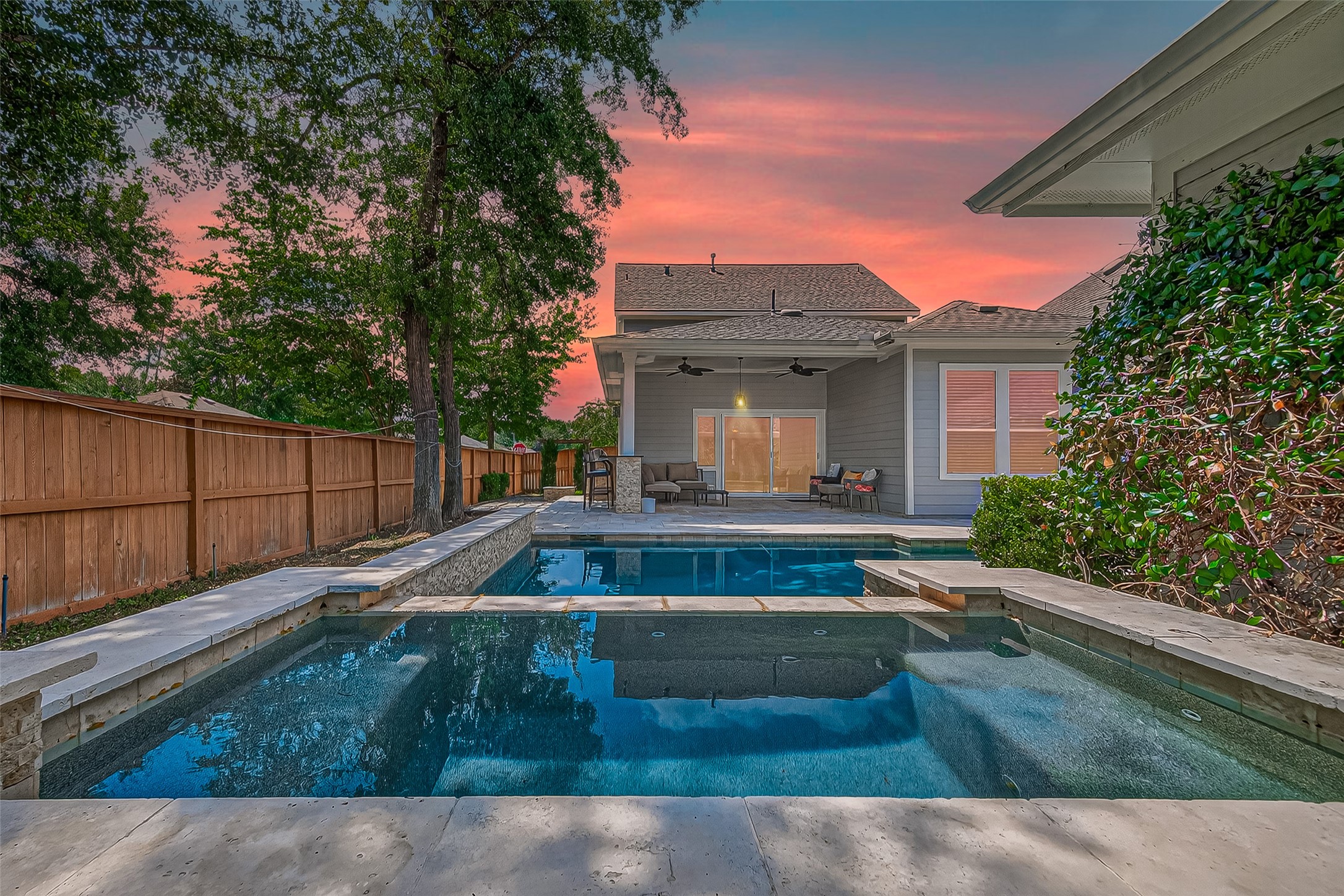 30 Whetstone Ridge Way The Woodlands, TX 77382 - Photo 2 of 39 a view of a house with backyard and sitting area