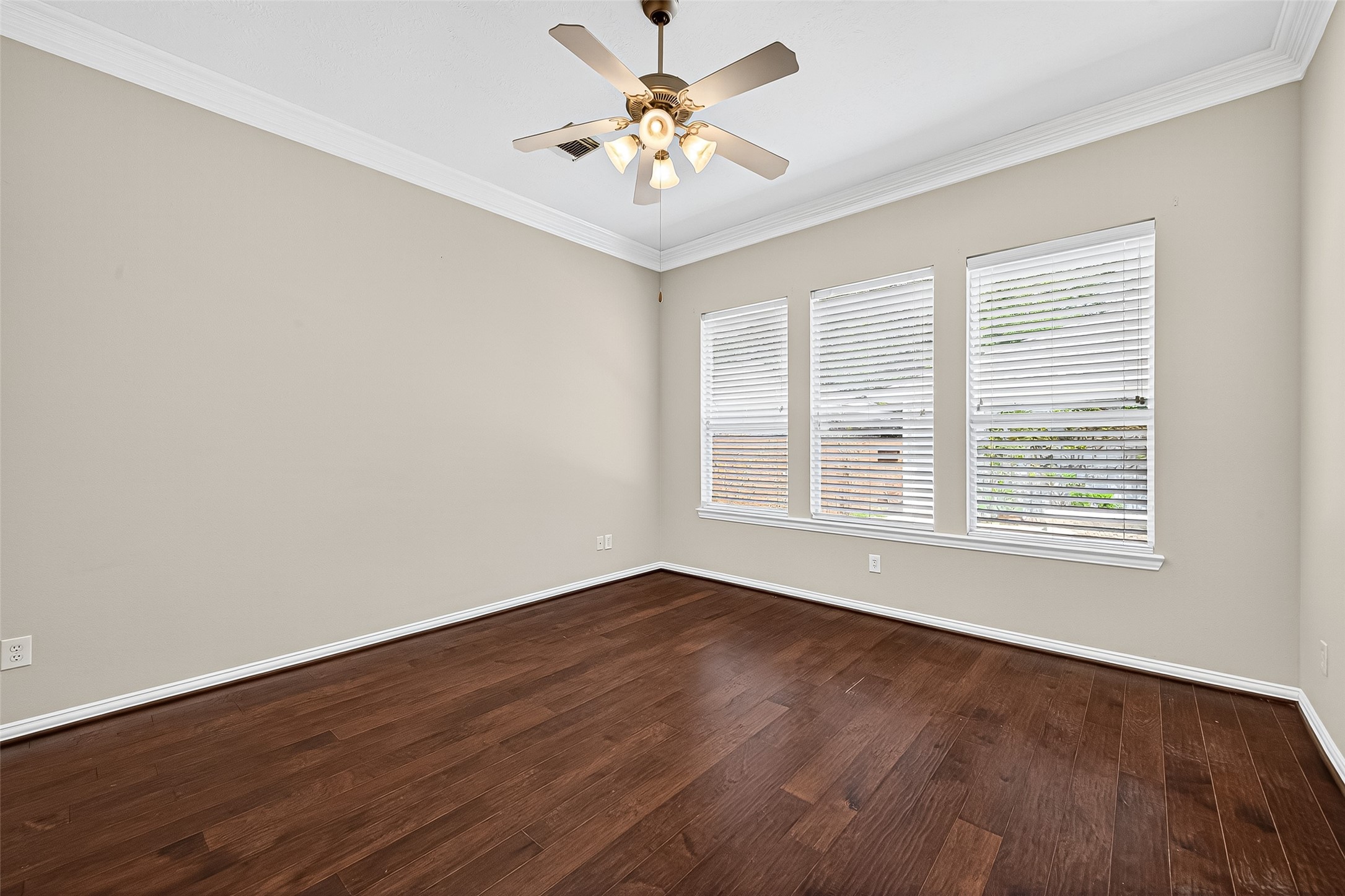 30 Whetstone Ridge Way The Woodlands, TX 77382 - Photo 24 of 39 a view of an empty room with window and wooden floor