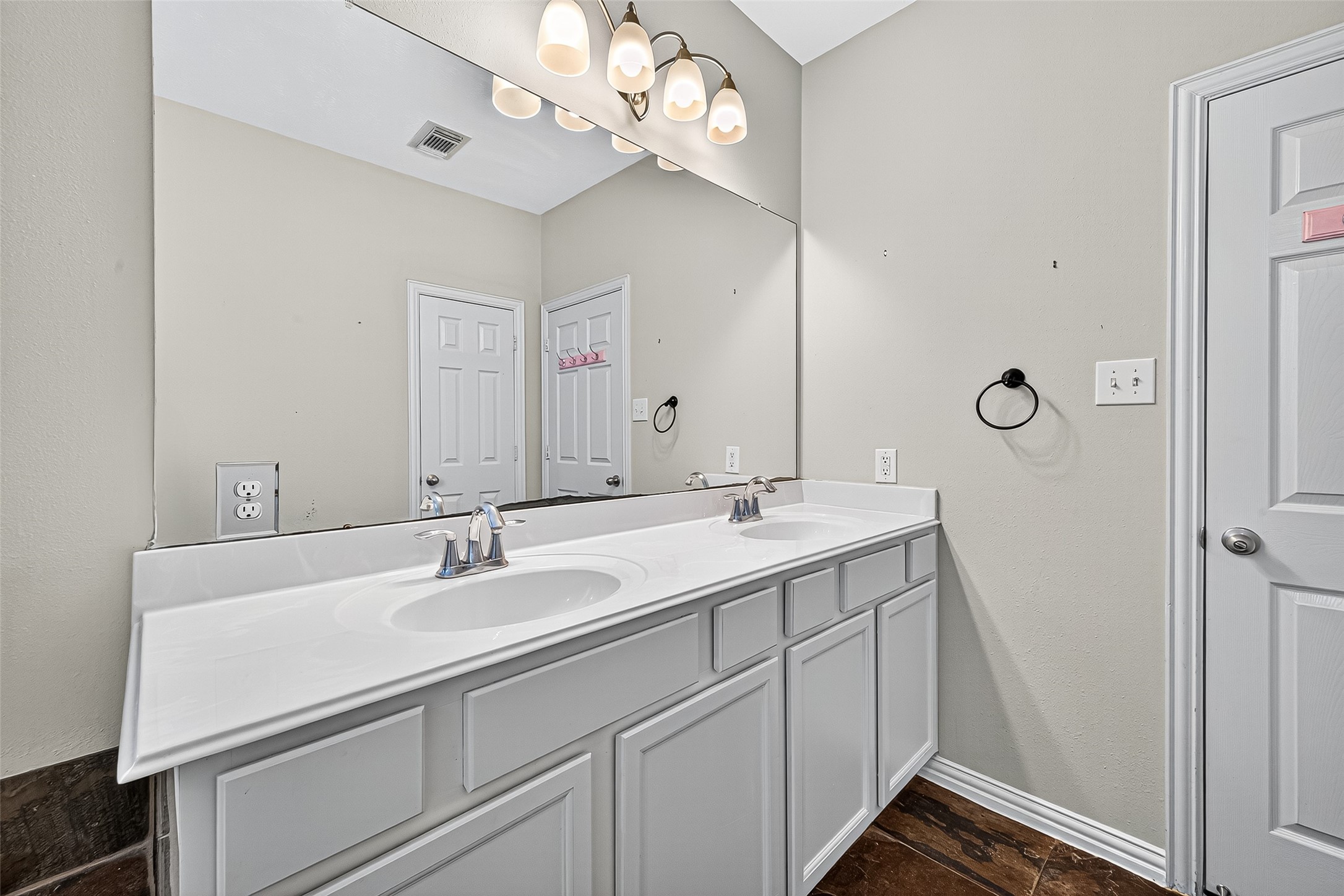 30 Whetstone Ridge Way The Woodlands, TX 77382 - Photo 26 of 39 a bathroom with a sink a vanity and a mirror