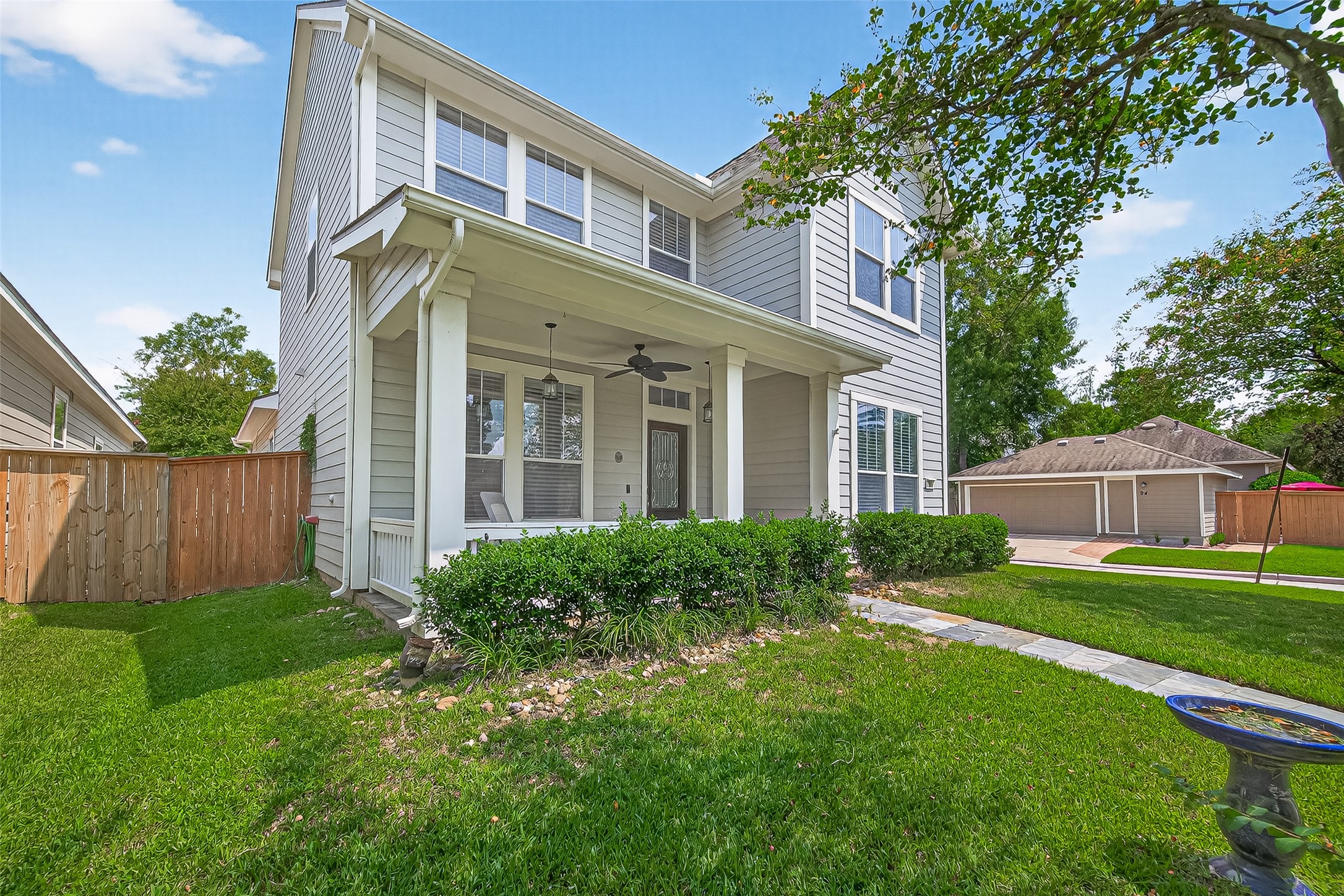 30 Whetstone Ridge Way The Woodlands, TX 77382 - Photo 3 of 39 front view of a house with a yard