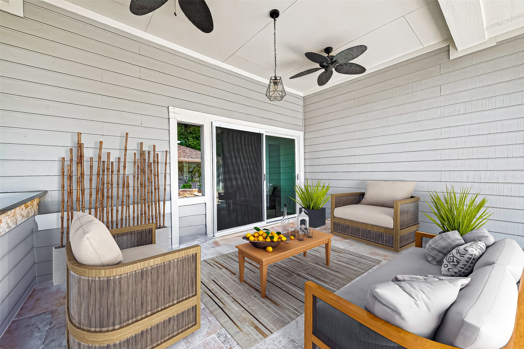30 Whetstone Ridge Way The Woodlands, TX 77382 - Photo 33 of 39 a view of a patio with couches chairs and a potted plant