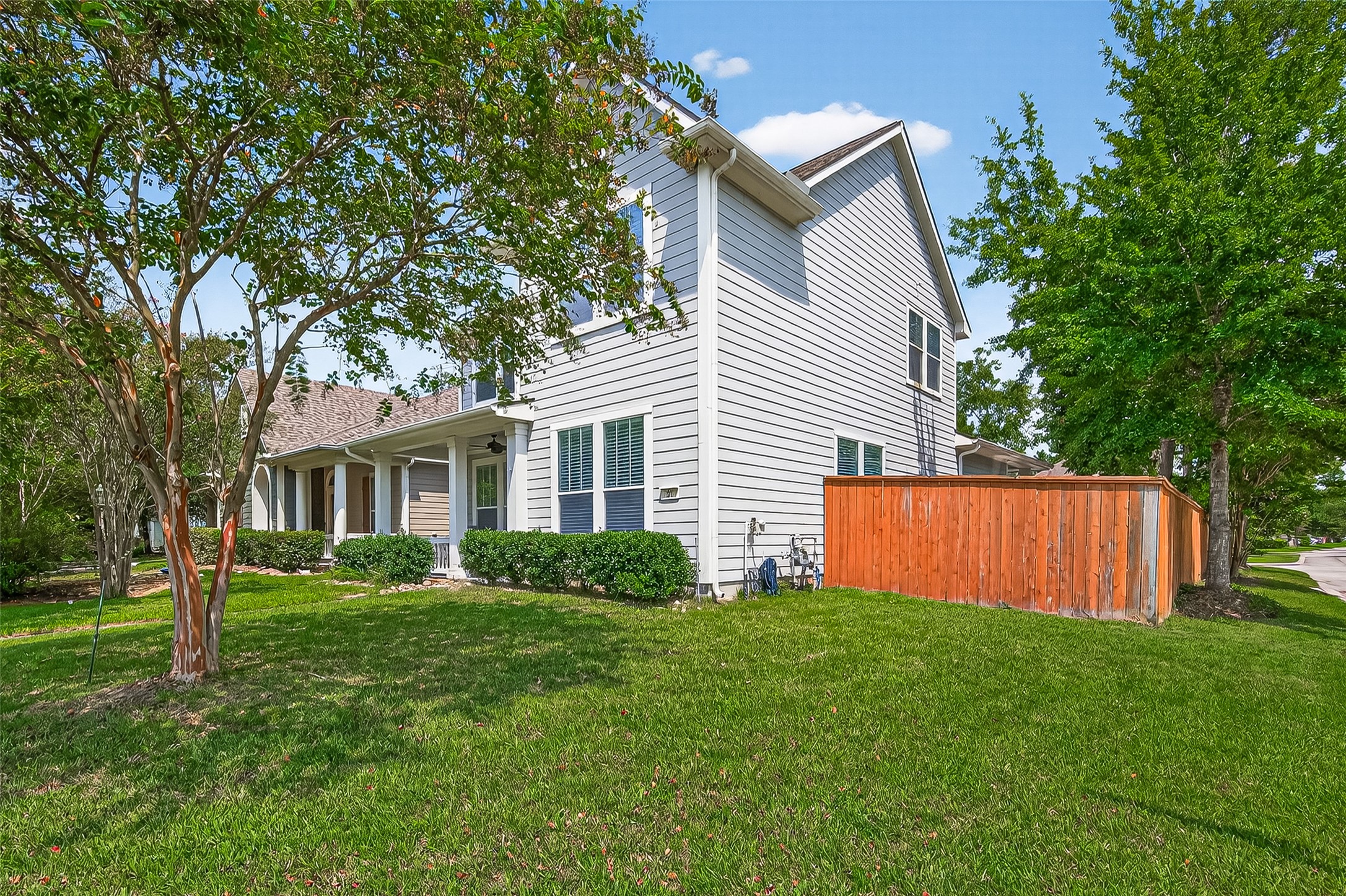 30 Whetstone Ridge Way The Woodlands, TX 77382 - Photo 4 of 39 a view of a house with a yard and sitting area